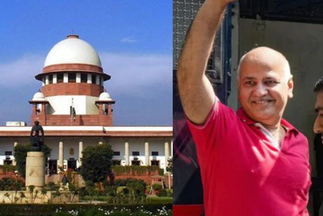 Manish Sisodia, smiling, standing next to the dome of the Supreme Court of India building.